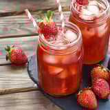Two glasses of Southern Strawberry Sweet Iced Tea.
