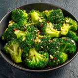 A bowl of crispy garlic air fryer broccoli.