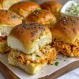 A plate of spicy buffalo chicken sliders.