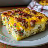 A slice of bacon and cheese casserole.