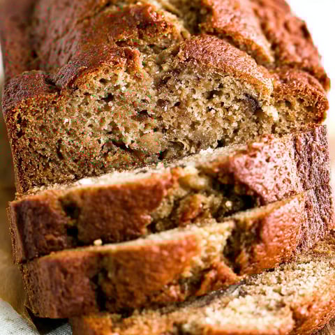 A slice of banana bread on a table.